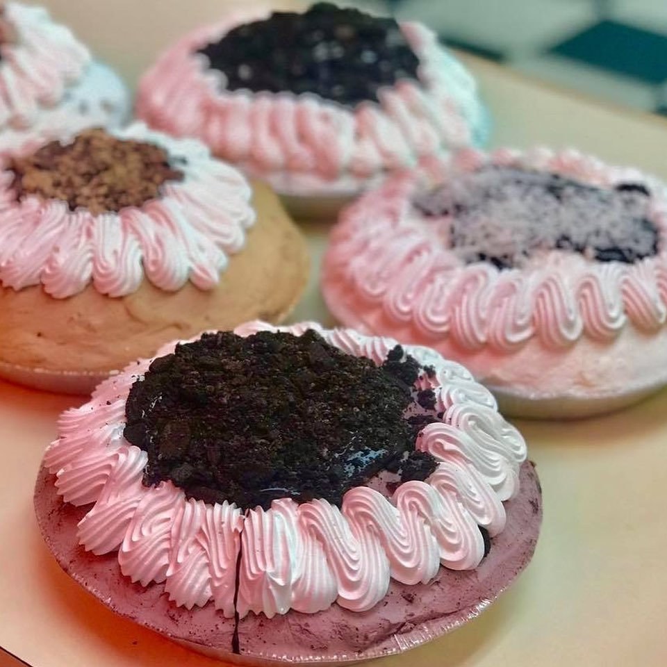 Ashley’s ice cream pies with pink whipped cream borders and crushed cookie centers