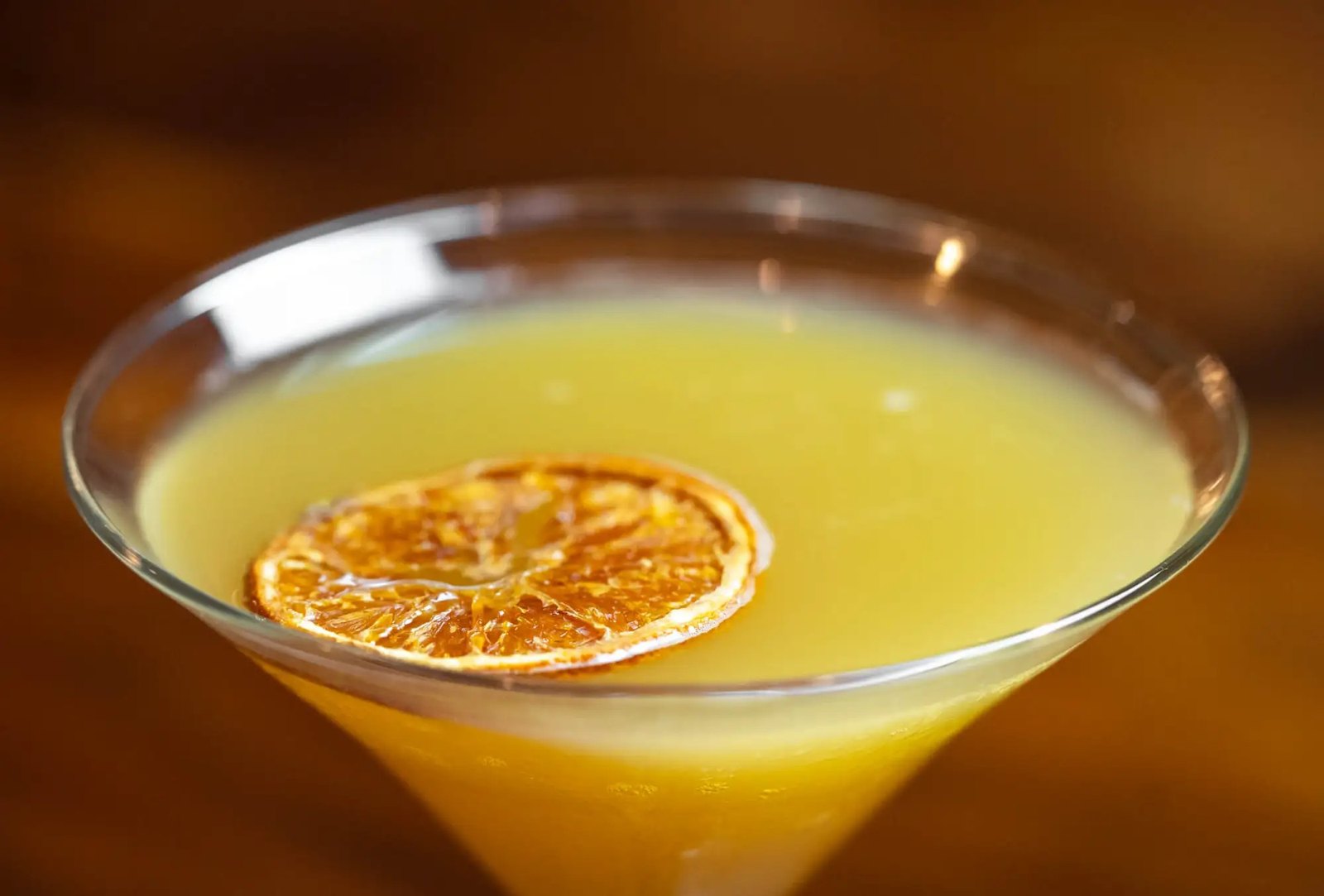 A brunch martini garnished with a dried orange slice at Bella’s Cafe