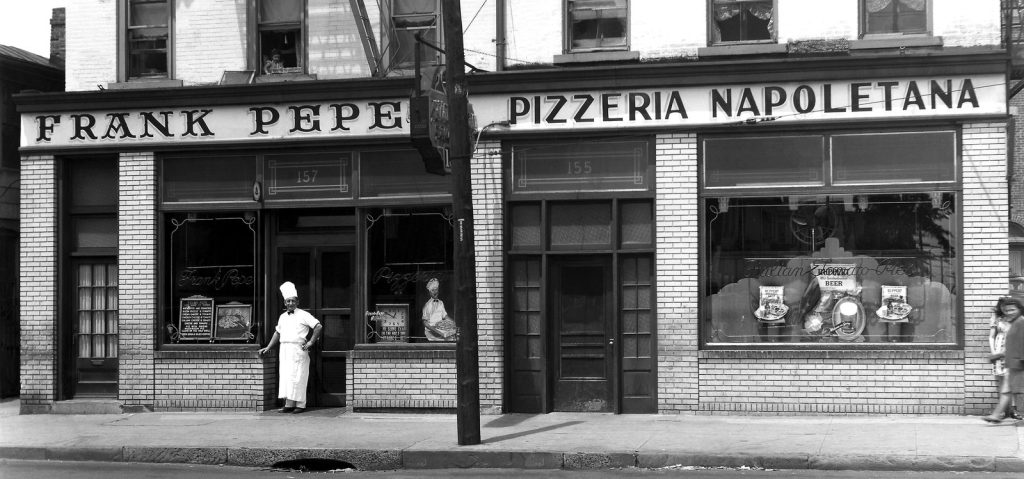 A historic photograph of the Frank Pepe Pizzeria Napoletana storefront on Wooster Street