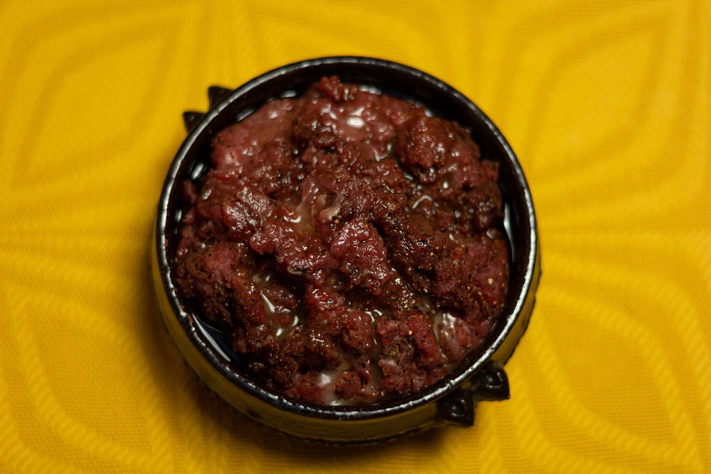 Lalibela’s kitfo, finely chopped seasoned beef in a black clay dish
