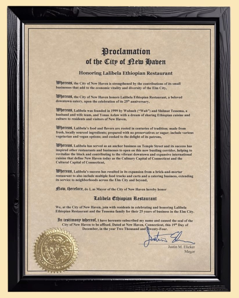 The framed City of New Haven proclamation honoring Lalibela Ethiopian Restaurant for 25 years, signed by Mayor Justin Elicker on Dec. 19, 2024
