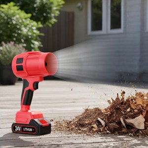 Red Wood Ranger cordless leaf blower clearing leaves from a patio