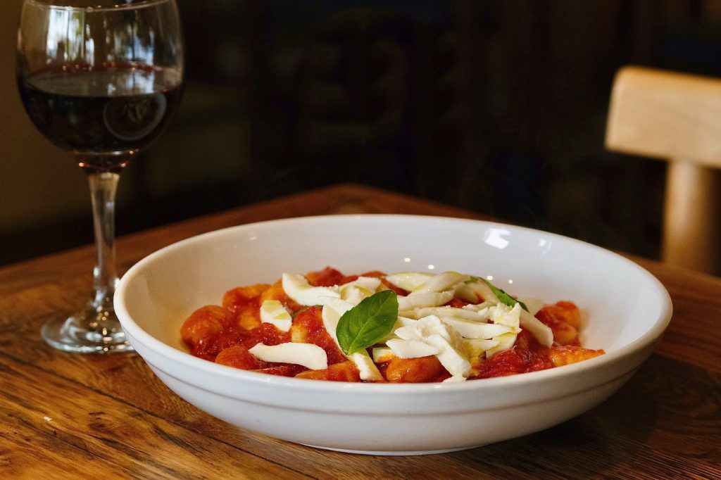 Gnocchi alla Sorrentina in a bowl with tomato sauce and mozzarella