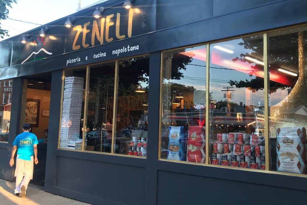 The Zeneli storefront on Wooster Street with gold lettering on a dark facade